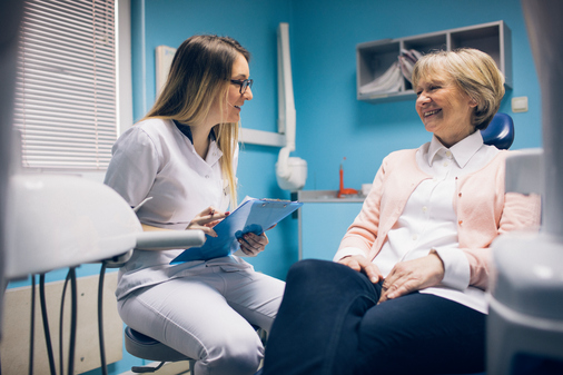A patient learning about the cosmetic procedures available at Roy C. Blake III, DDS, MSD, Maxillofacial Prosthodontist near West Palm Beach Florida.