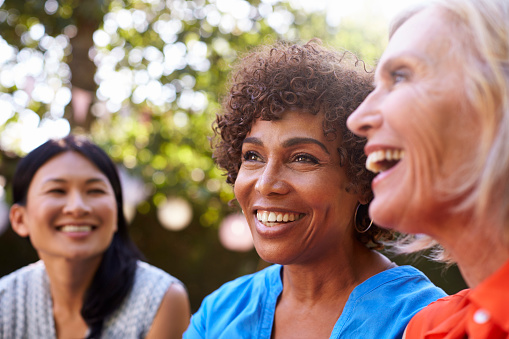 A group of smiling older women with dental implants from Roy C. Blake III, DDS, MSD, Maxillofacial Prosthodontist in Jupiter, FL